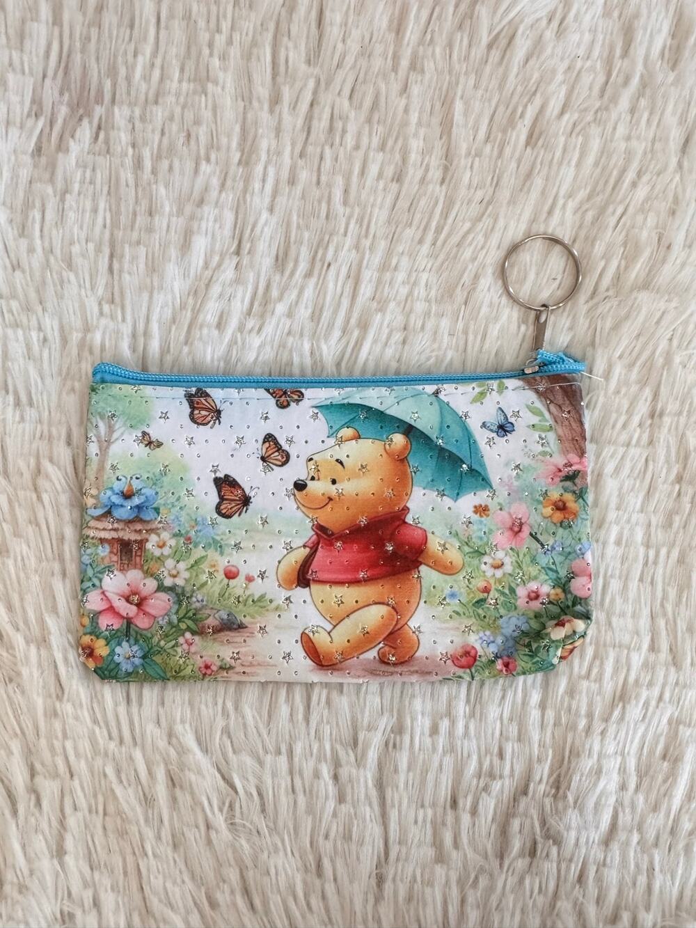 Winnie the Pooh pencil case Pooh holding an umbrella surrounded by butterflies